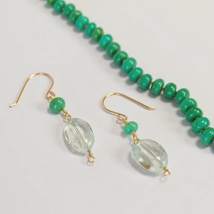 A close-up view of a green amethyst, showcasing its vibrant green hues and natural crystal formations.
