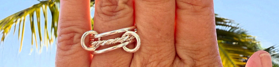 Woman's hand wearing Spinelli ring dupe