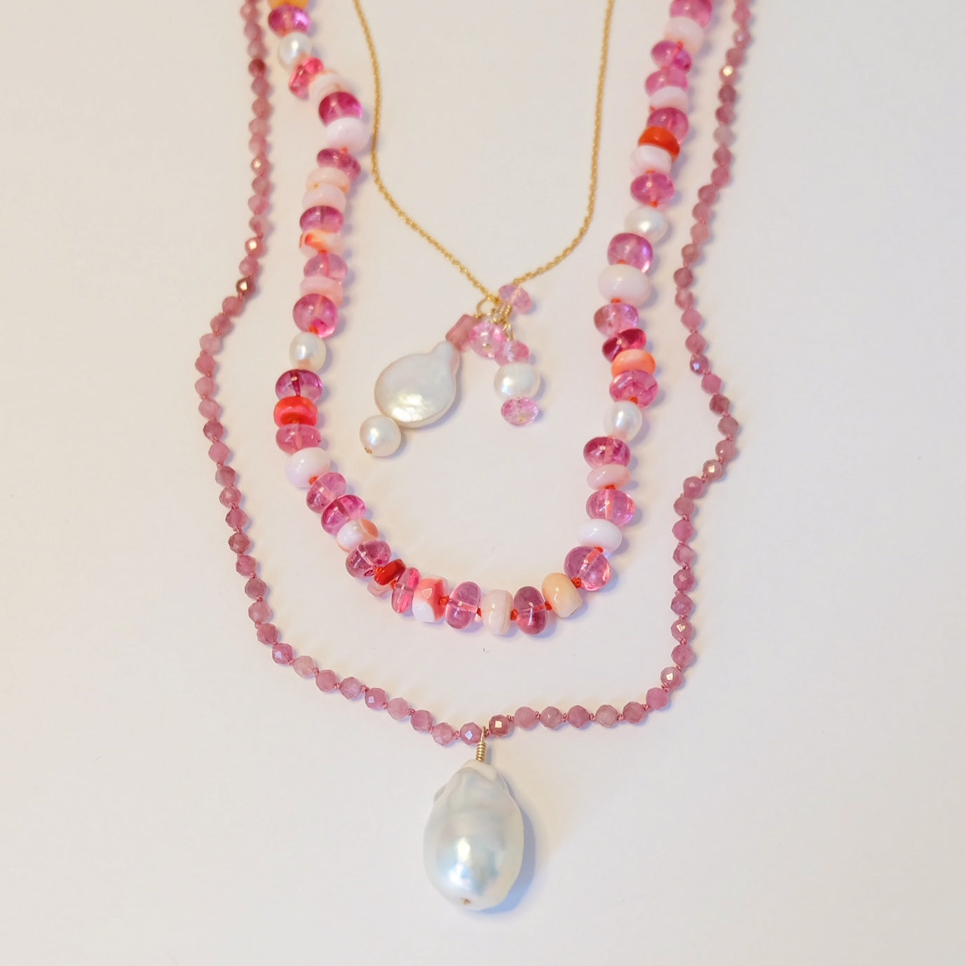 Elegant pink gemstone jewelry featuring intricate designs and a radiant shine, perfect for any special occasion.