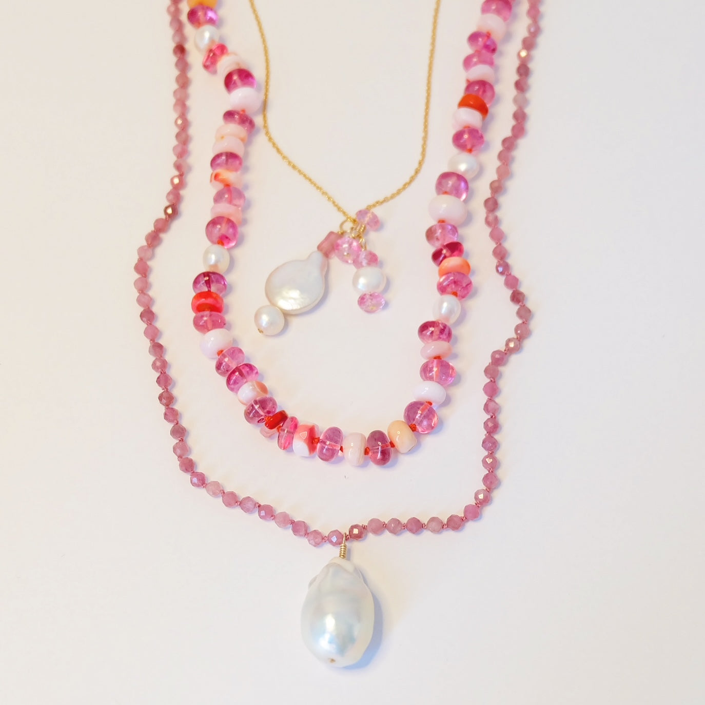 Gemmy Gem Jewelry with candy-colored gemstones, hand-knotted silk, and gold clasp