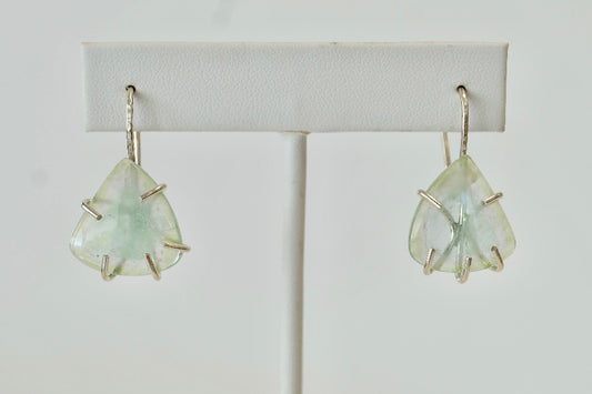 Pair of Aquamarine Dangle Earrings earrings on a white background