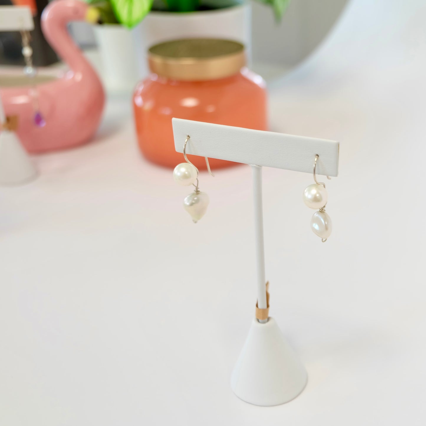 Timeless pearl drop earrings featuring exquisite pearls that elegantly drop from sterling silver, enhancing any jewelry collection.