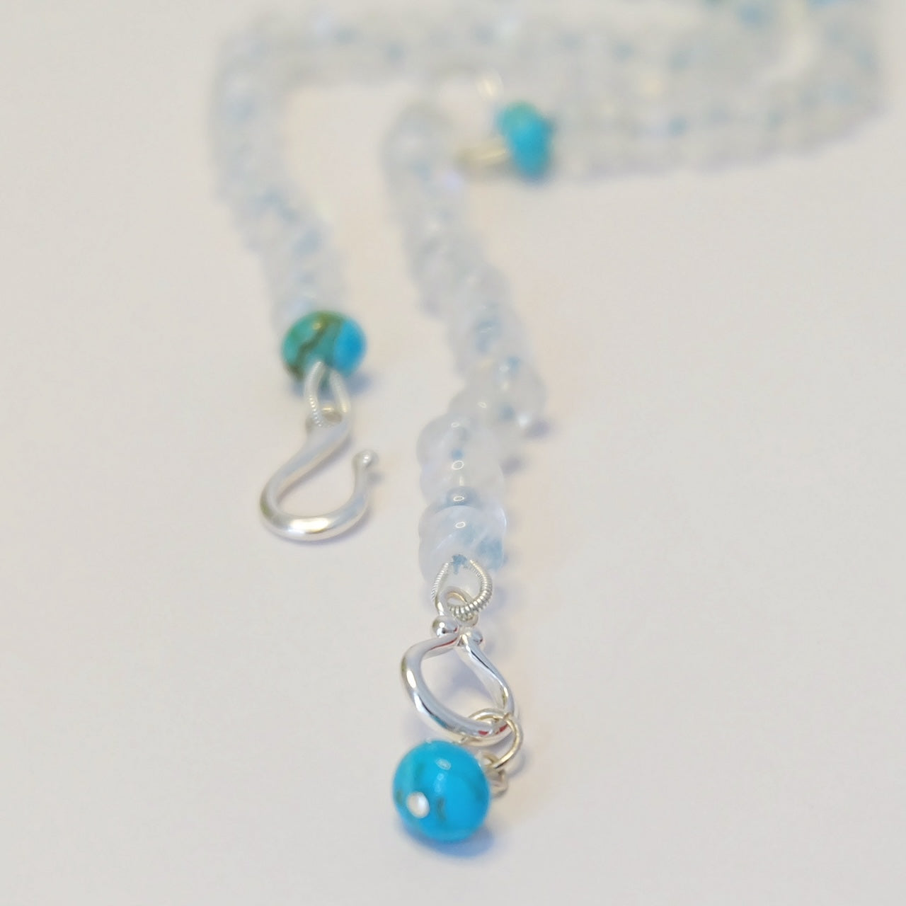 Close up of turquoise moonstone lariat necklace