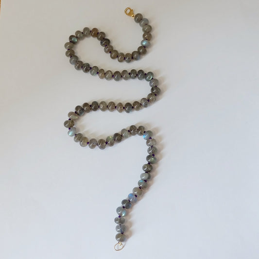 Smooth rondelle labradorite beads flashing blue on a gemston necklace with a 14K gold-filled clasp