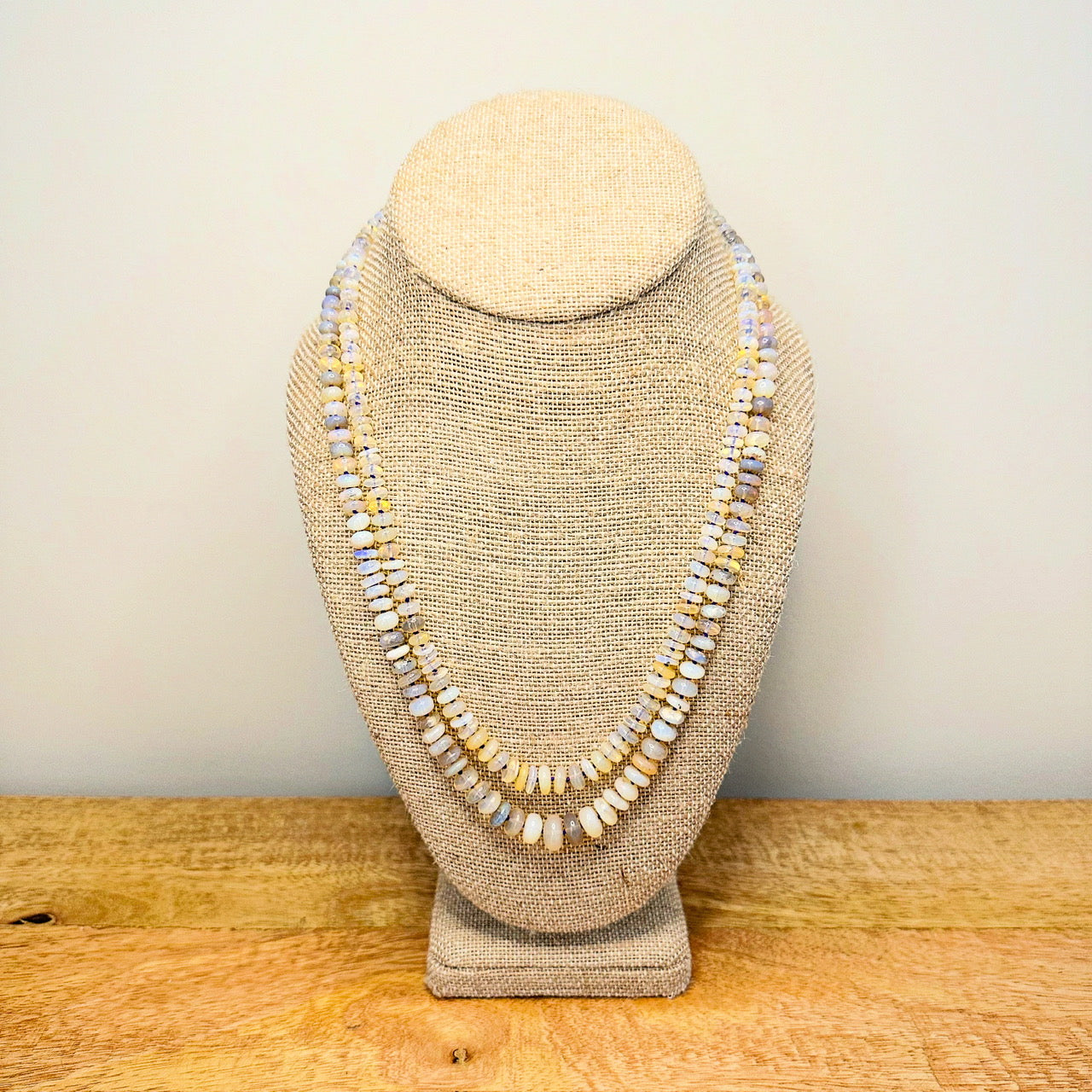A stunning opal beaded necklace featuring iridescent stones that shimmer in various colors, elegantly strung together.