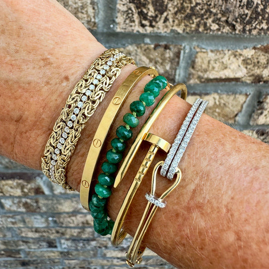Collection of bead bracelets on woman's hand