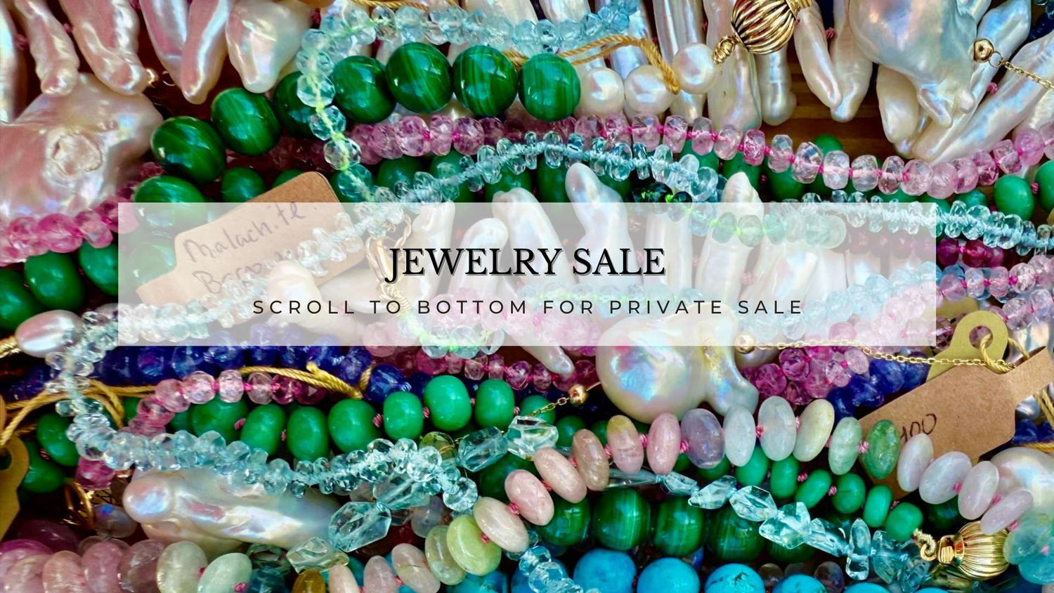 A vibrant display of assorted jewelry pieces on sale, showcasing necklaces, bracelets, and earrings in various styles.