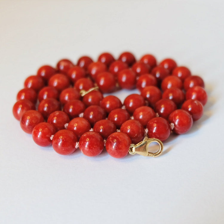 An assortment of red jewelry items, highlighting the beauty of necklaces, bracelets, and earrings in striking shades of red.