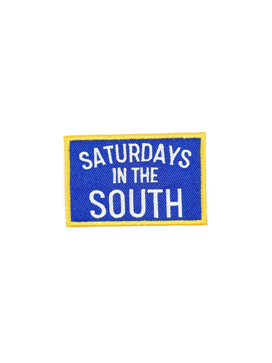 Embroidered patch with 'Saturdays in the South' text on a blue background