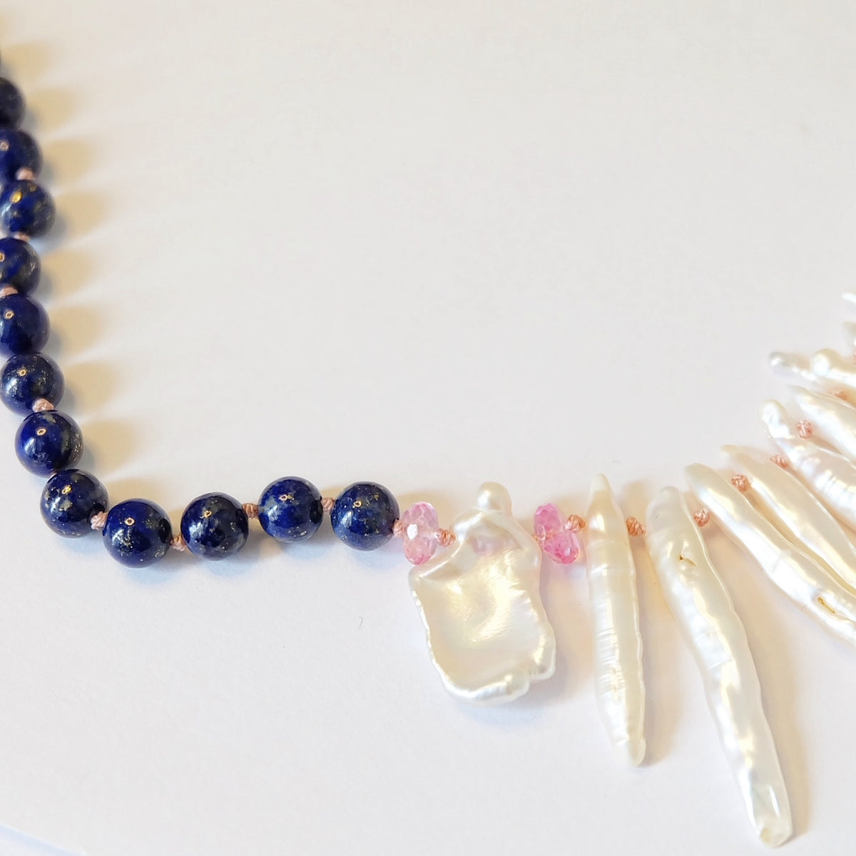 Close-up of Japanese Biwa pearls on a lapis lazuli necklace