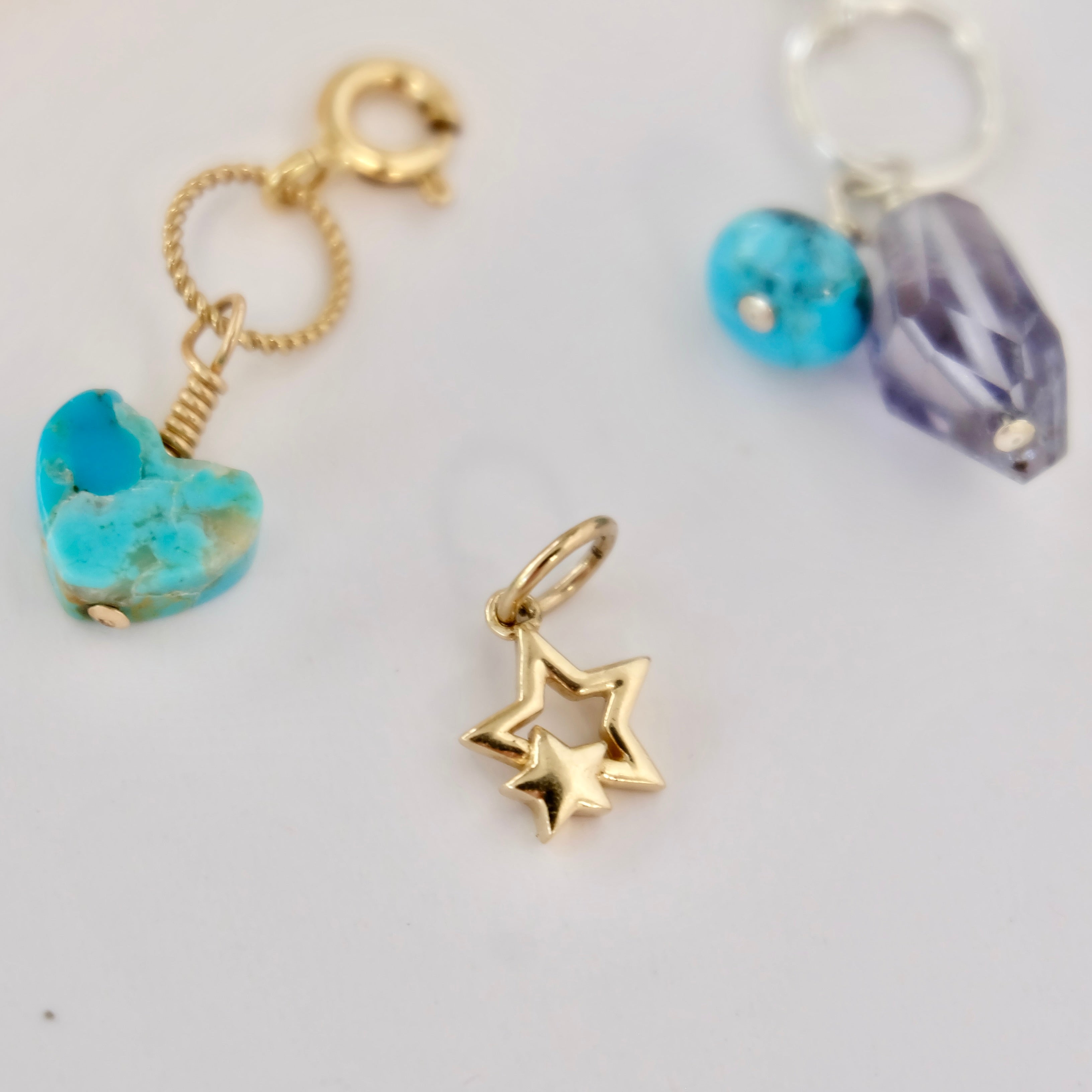 14K gold double star charm in solid gold