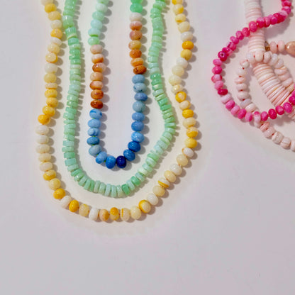 14K gold-filled green opal candy necklace stacked with multi-color gemstone jewelry strands.