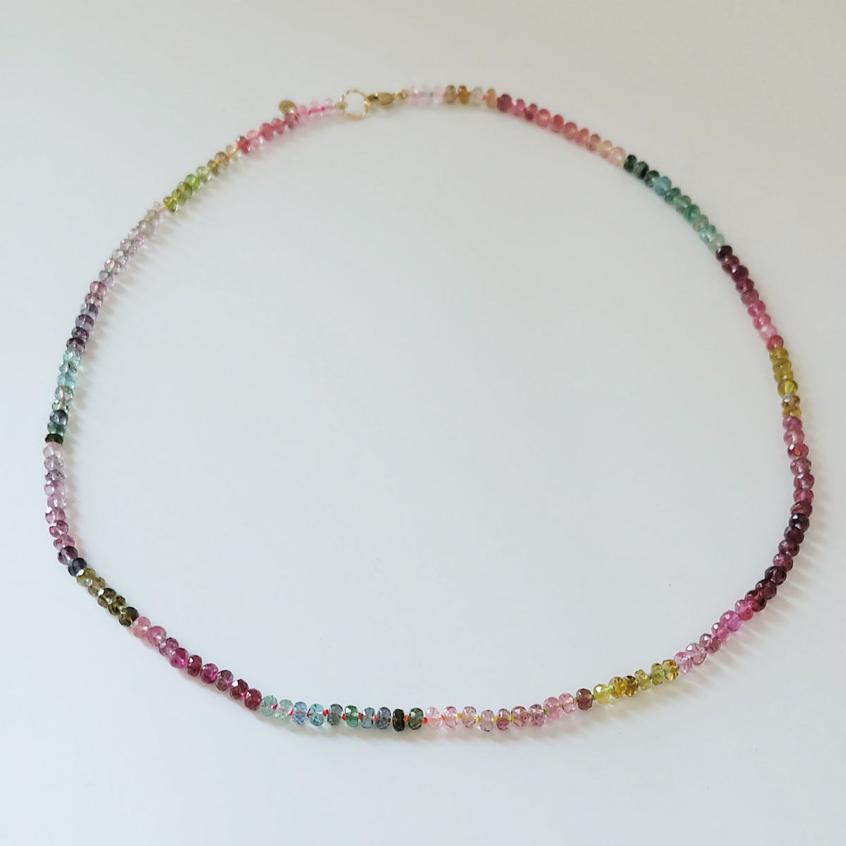 Full strand of a 14K gold watermelon tourmaline candy necklace with 4mm beads