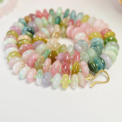 Limited-edition 14K gold watermelon tourmaline candy necklaces with custom-dyed silk threads.