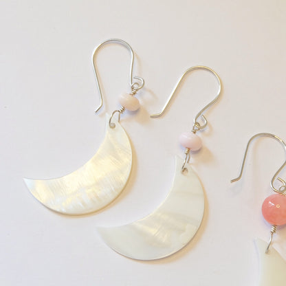 Stunning drop earrings adorned with Mother of Pearl gemstones, showcasing a refined and elegant design for any occasion.