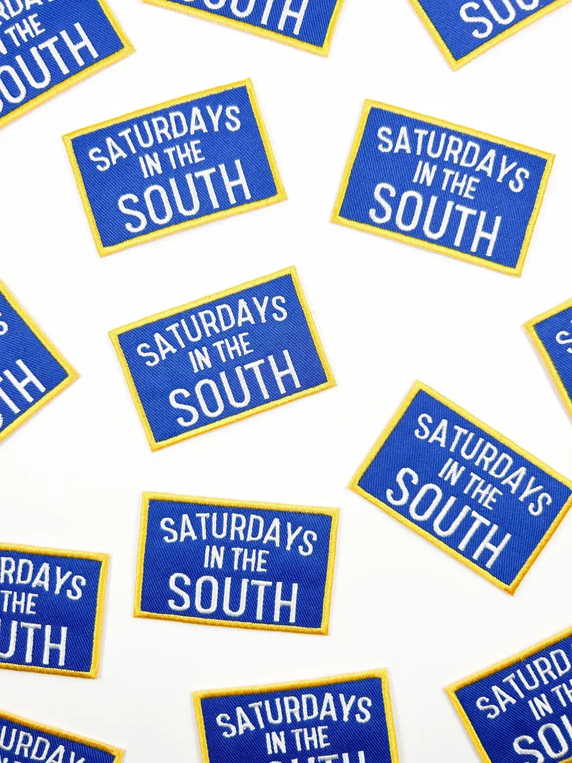 Pattern of 'Saturdays in the South' patches on a white background