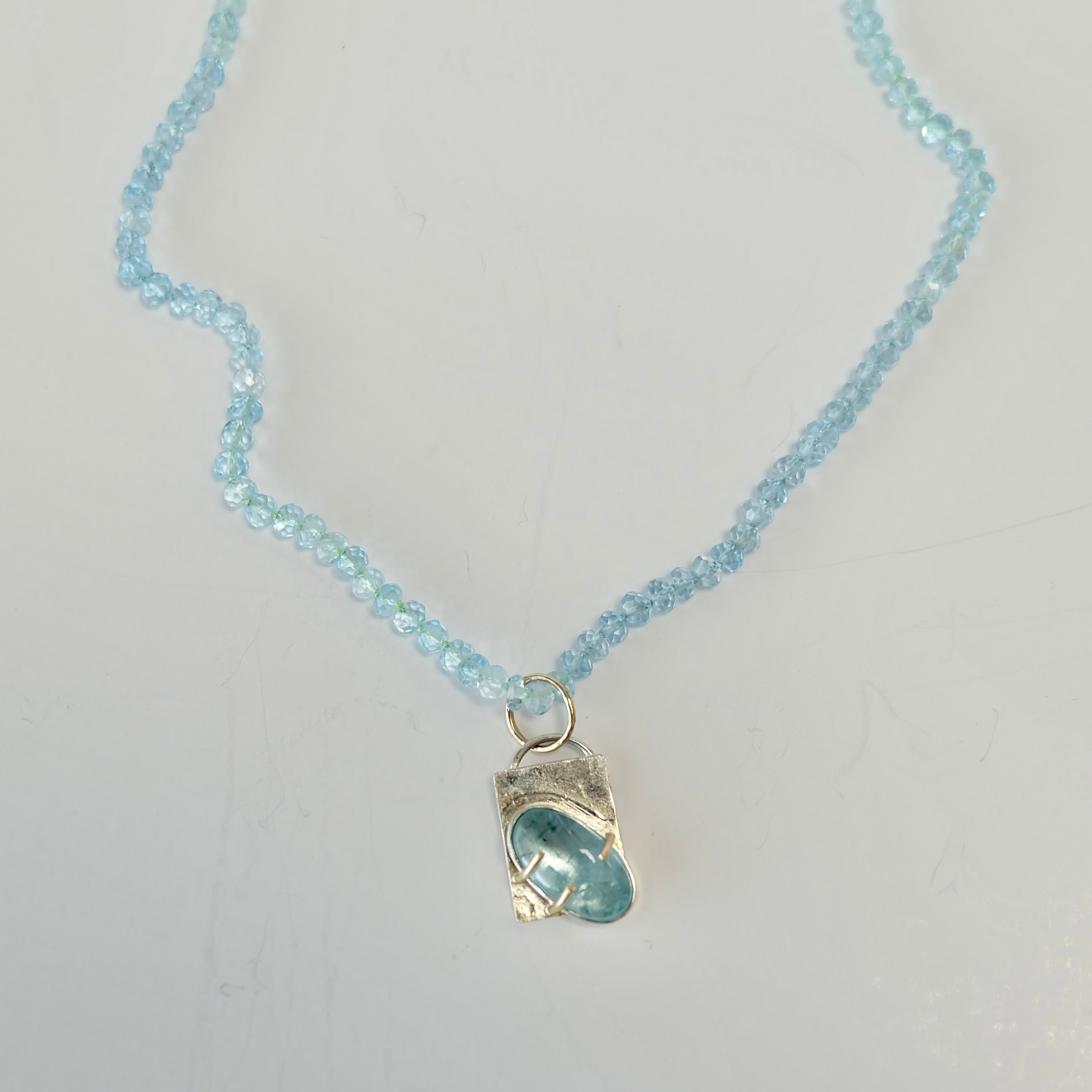 Aquamarine Charm Necklace in 14K gold with AAA aquamarine beads and removable charm.