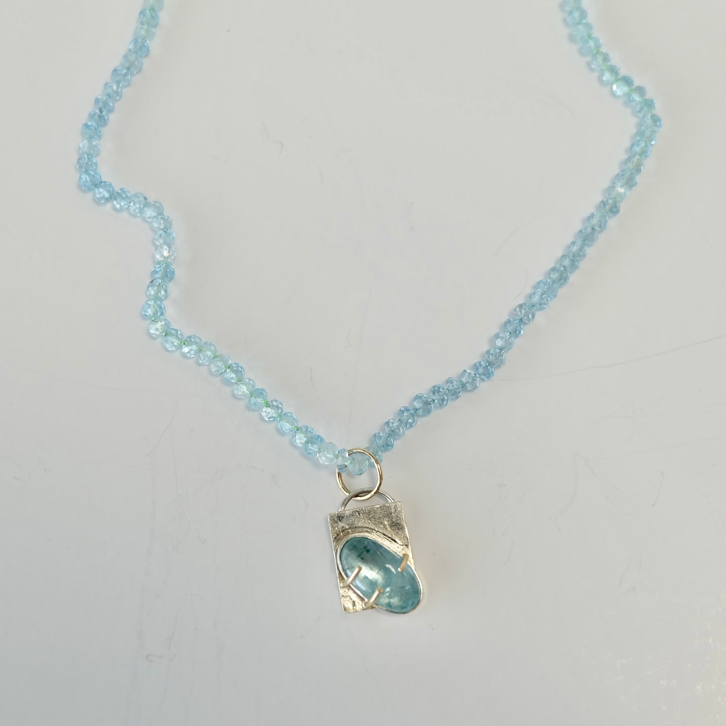 Aquamarine Charm Necklace in 14K gold with AAA aquamarine beads and removable charm.