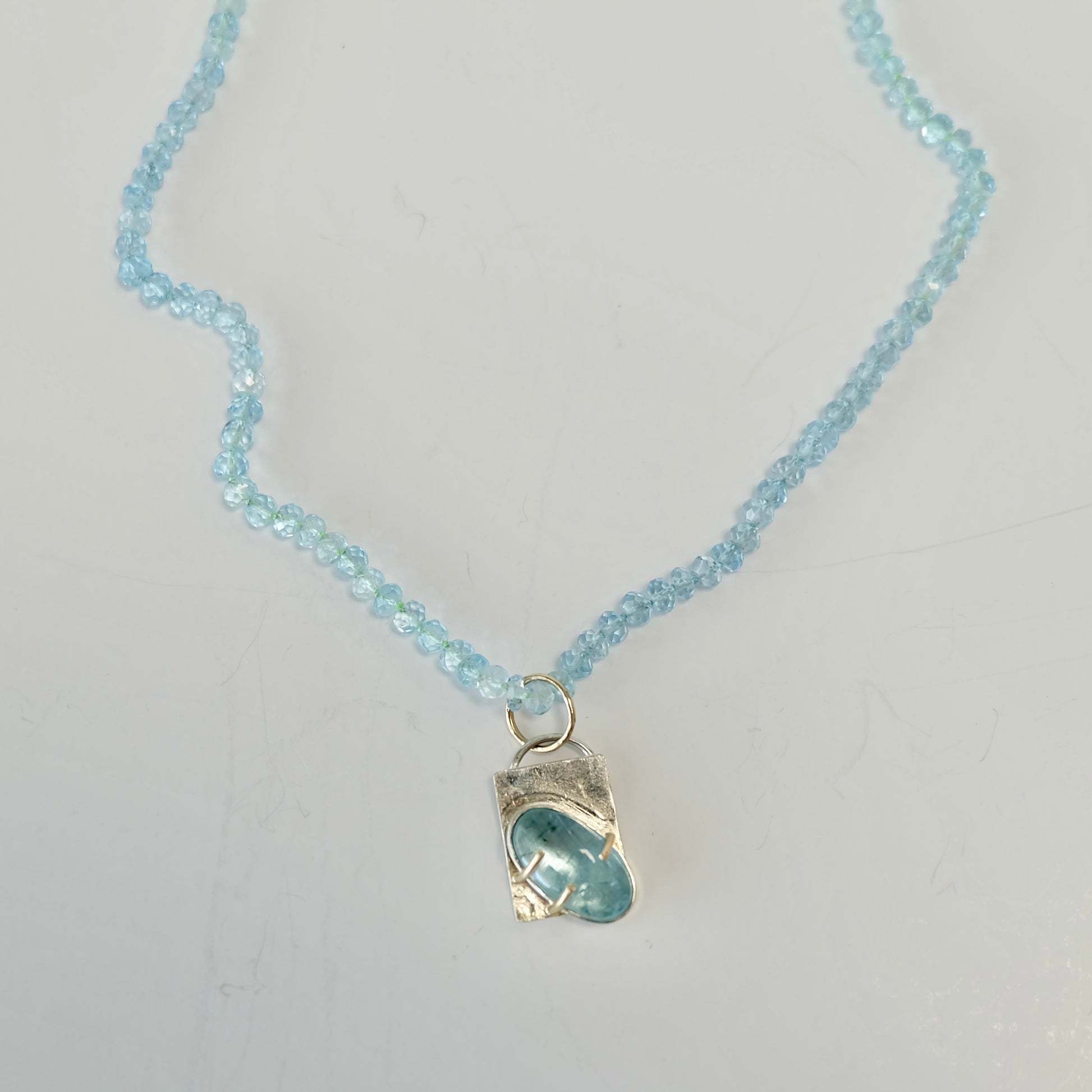 Aquamarine Charm Necklace in 14K gold with AAA aquamarine beads and removable charm.