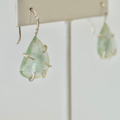 Aquamarine dangle earring set in sterling silver on a white background