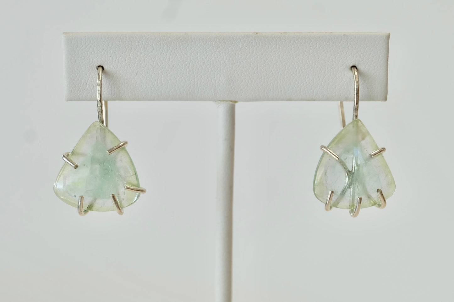 Pair of Aquamarine Dangle Earrings  earrings on a white background