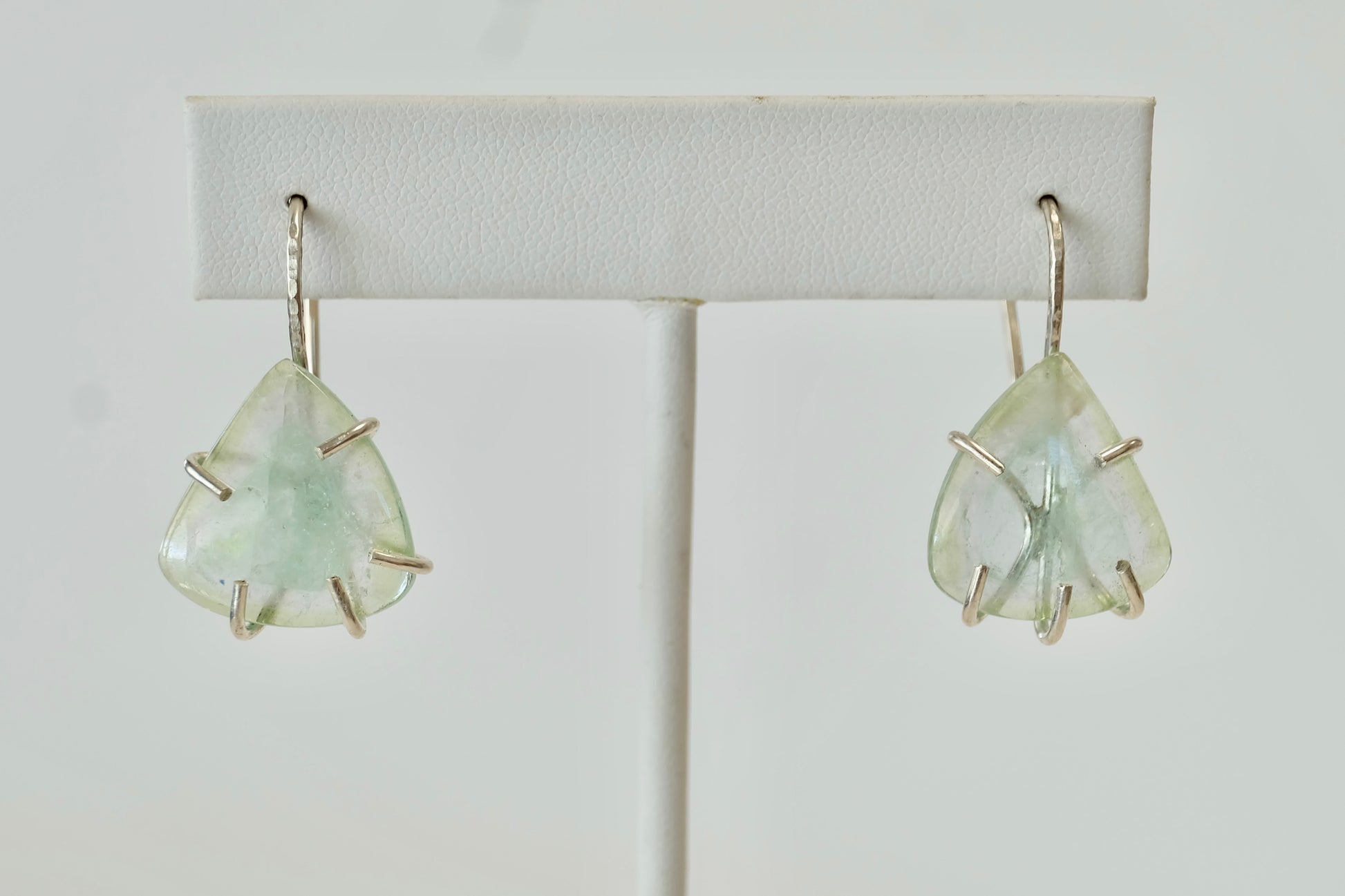 Pair of Aquamarine Dangle Earrings  earrings on a white background