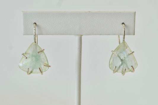 Pair of Aquamarine Dangle Earrings  earrings on a white background