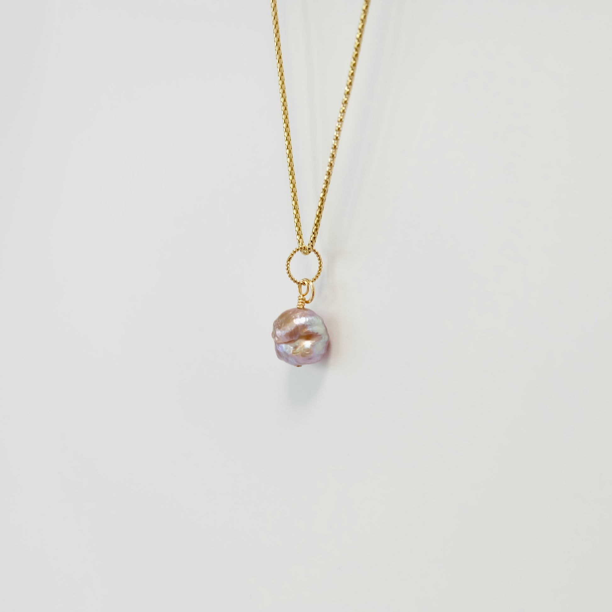 Elegant freshwater pearl charm, handcrafted with care on 14k gold-filled wire, perfect for adding a touch of sophistication.