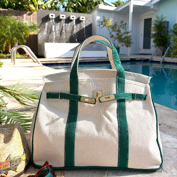 Green Boatkin bag open by a pool.