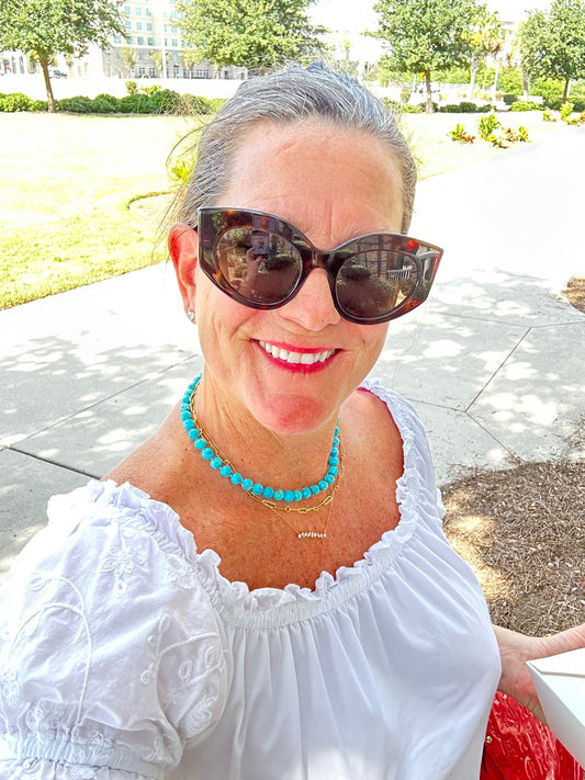 Charming Kingman turquoise necklace in 14k gold featuring bright blue stones, artfully designed in silver, perfect for enhancing personal style.