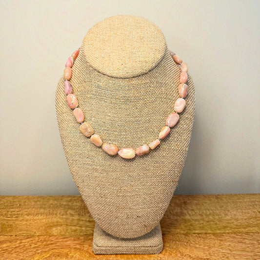 Elegant pink opal bead necklace showcasing soft, pastel hues, perfect for adding a touch of sophistication to any outfit.