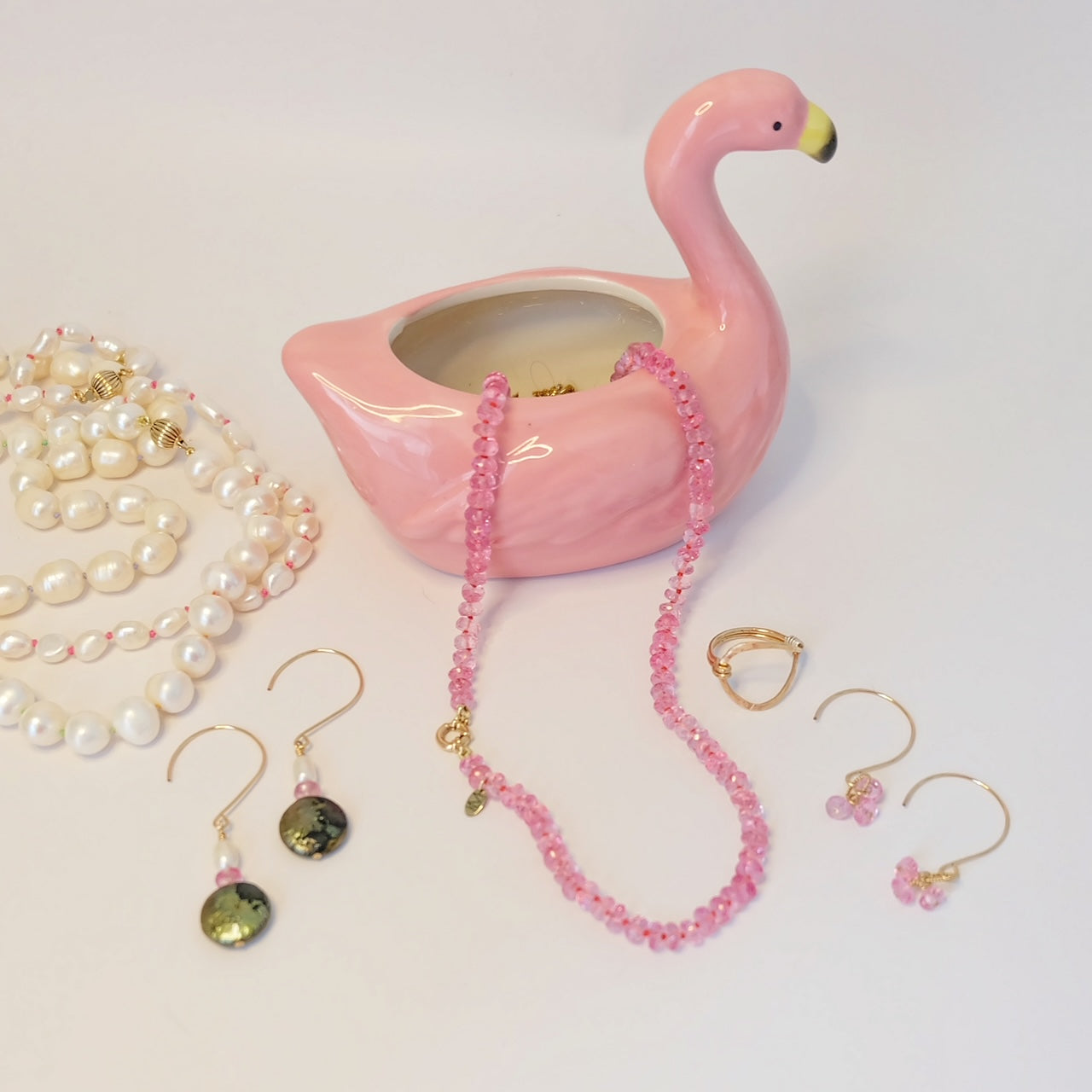 A delicate pink topaz candy necklace featuring 14K gold and shimmering gemstones, elegantly designed to enhance any outfit.
