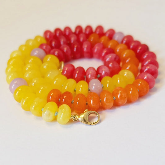 Colorful rainbow bead candy necklace featuring vibrant beads in various shapes and sizes, perfect for a playful accessory.