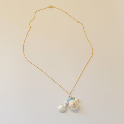 Handcrafted Aquamarine Pearl Opal Shell Charm Necklace with a dainty 14K gold filled chain, perfect for versatile styling.