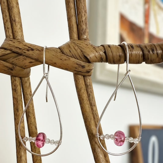 Elegant pink and white topaz dangle earrings, showcasing a stunning blend of colors and intricate design.