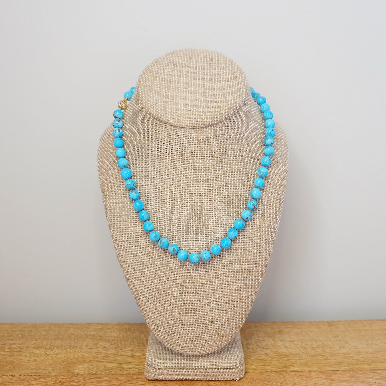 Turquoise necklace on display