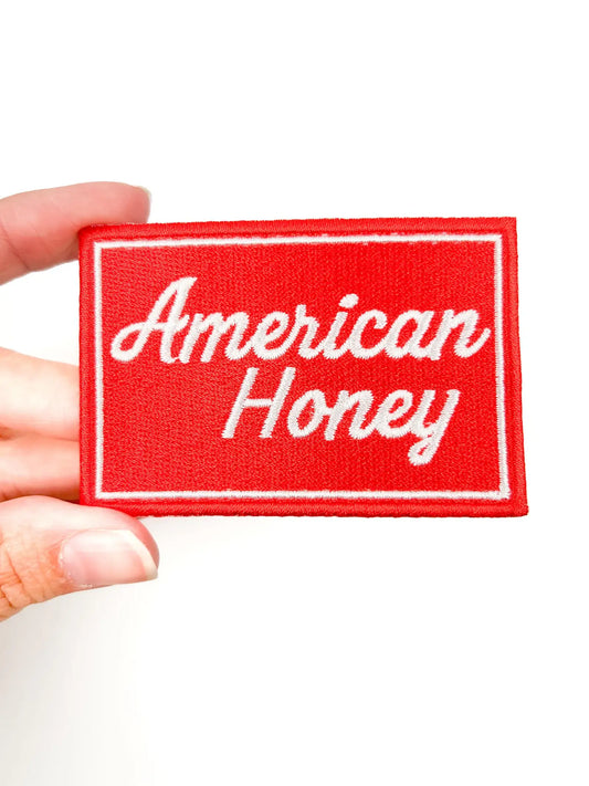 American Honey embroidered iron on patch, white script on red, 2x3 inches
