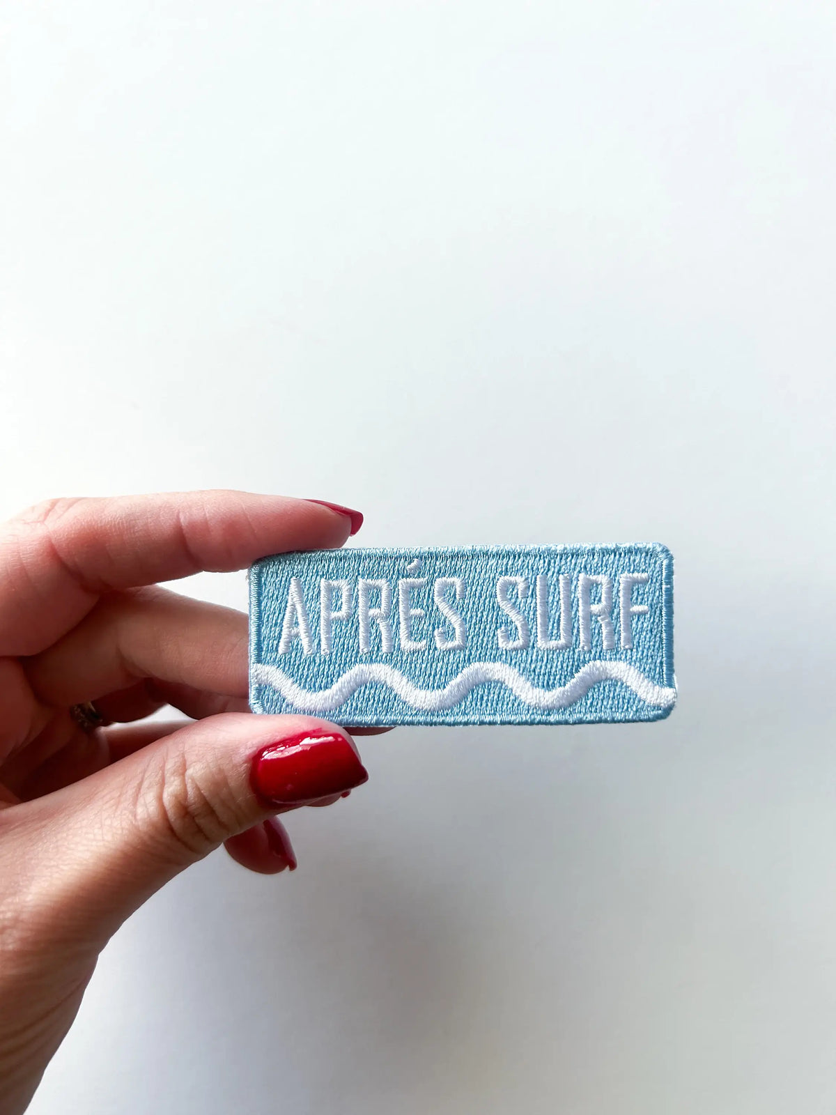 Après Surf embroidered iron-on patch with text lettering