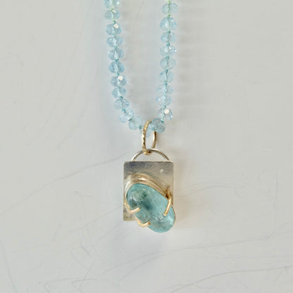 Close-up of aquamarine beads and the solid 14K gold lobster clasp