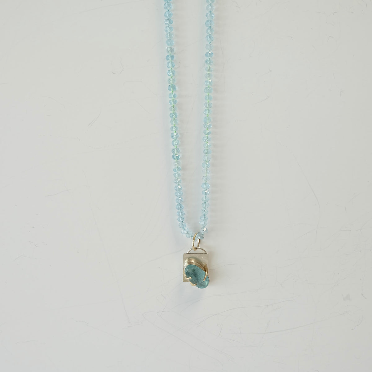 Aquamarine charm candy necklace styled with a simple outfit