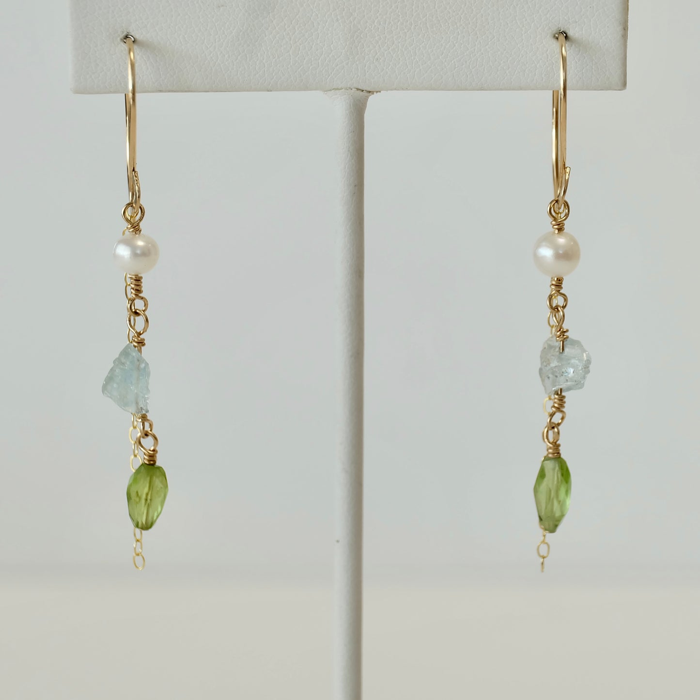 Front view of Aquamarine, Peridot & Pearl Dangle Earrings handcrafted with 14K gold-filled wire.