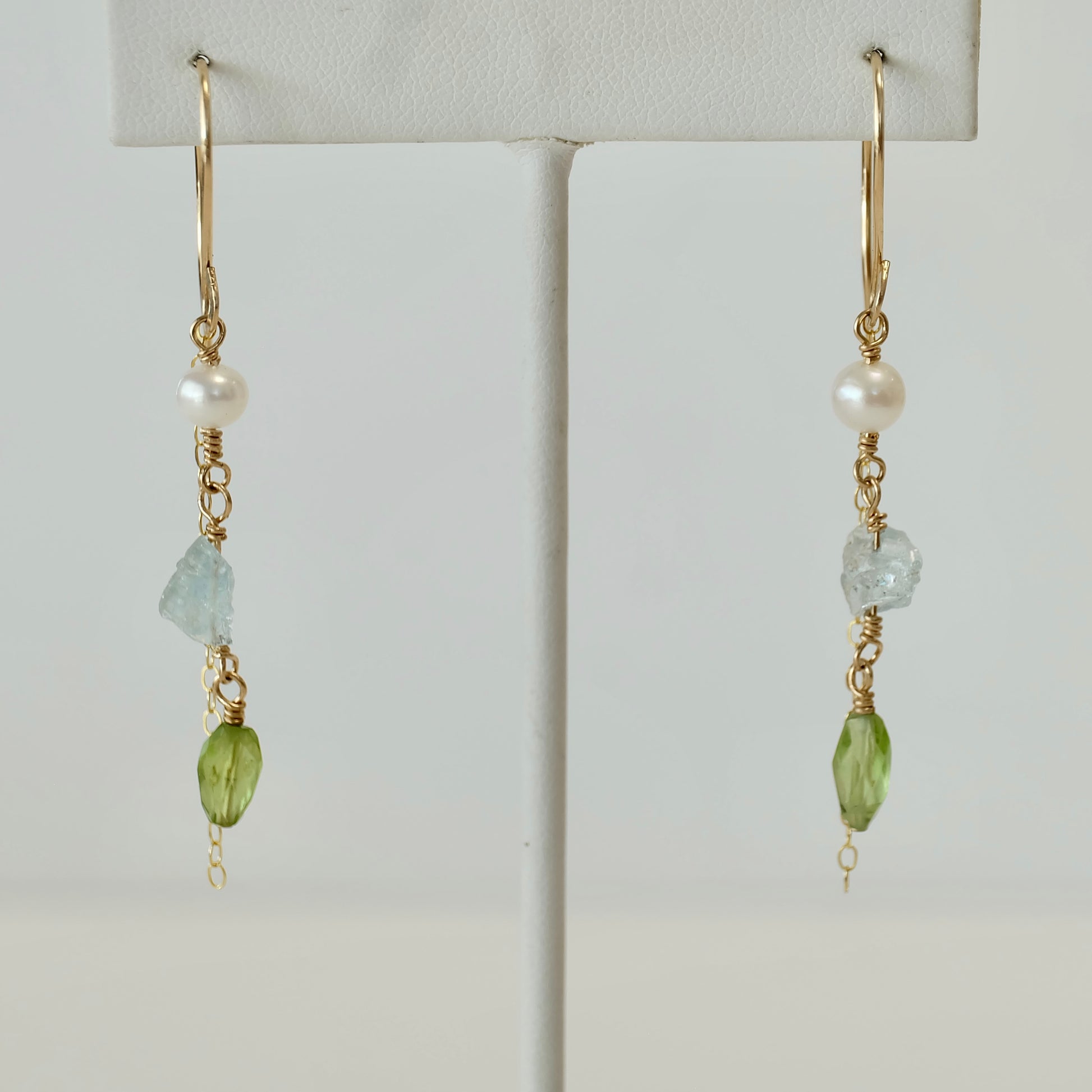 Front view of Aquamarine, Peridot & Pearl Dangle Earrings handcrafted with 14K gold-filled wire.