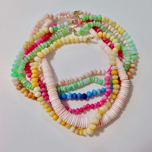 Colorful beaded candy necklaces made with pastel gemstones, styled to look like classic edible candy necklaces.