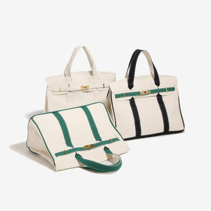 Group collection of three canvas Boatkin tote bags featuring brown trim, forest green trim, and black trim.