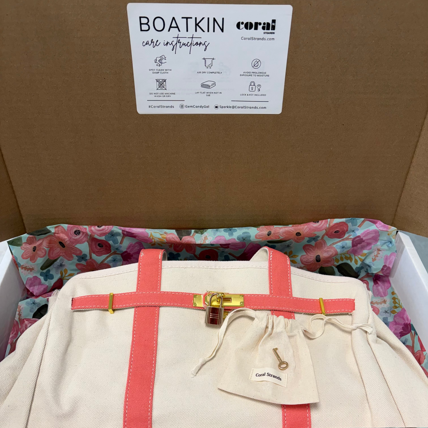 Boatkin bag packaging with care instructions card, floral tissue and lock and key pouch by Coral Strands