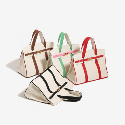 Group of four Boatkin canvas tote bags featuring brown, black, green, and red trim colors.