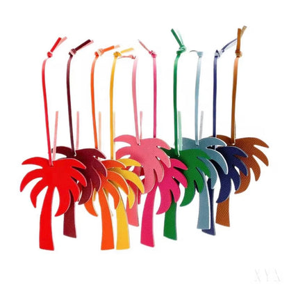 Boatkin palm tree bag charms in pink, red, green, navy, yellow, orange and brown.