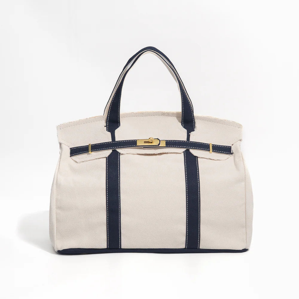 Boatkin tote bag with navy blue straps and trim on a white background
