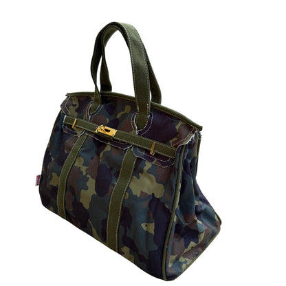 Camouflage Boatkin bag piping on a white background.