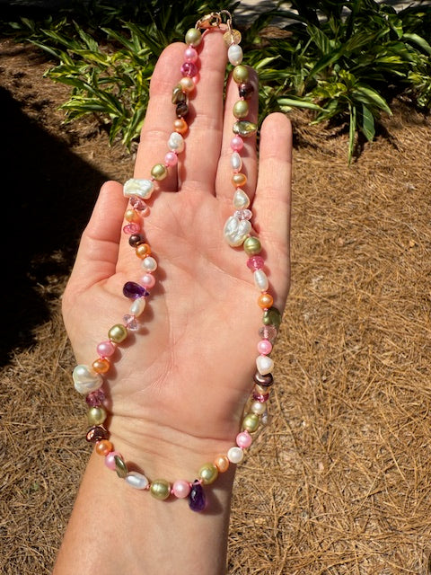 Candy Pearl Necklace flat lay with jewelry tray and linen